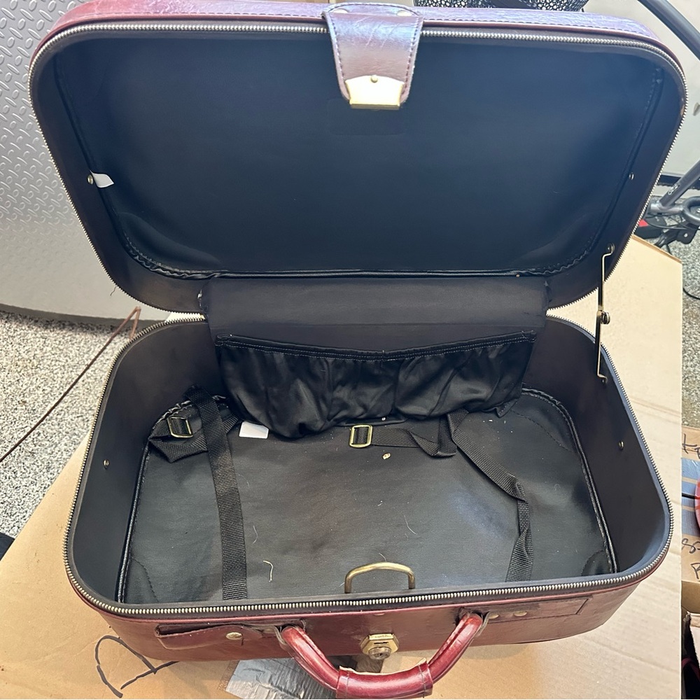 Brownish red Brittany Suitcase. Only ever been used to move.
